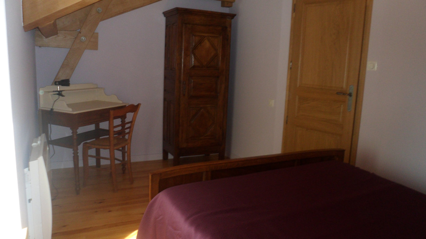Attic bedroom upstairs with antique wardrobe and desk, Le Rouge Gorge gîte